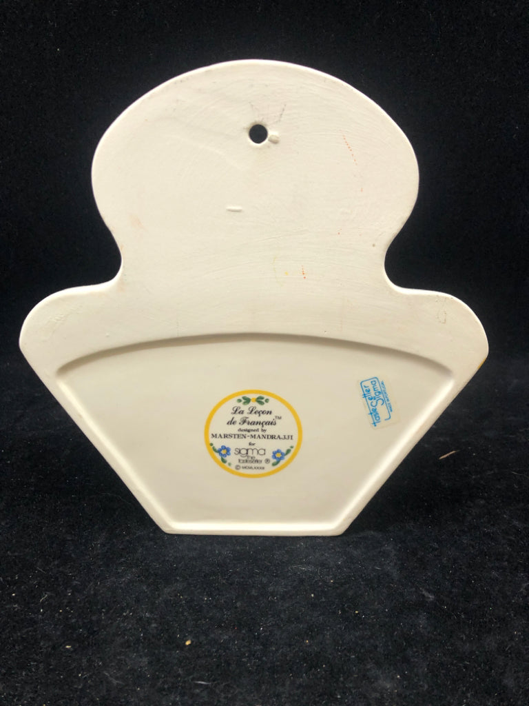 CERAMIC BLUE AND YELLOW COFFEE FILTER HOLDER.