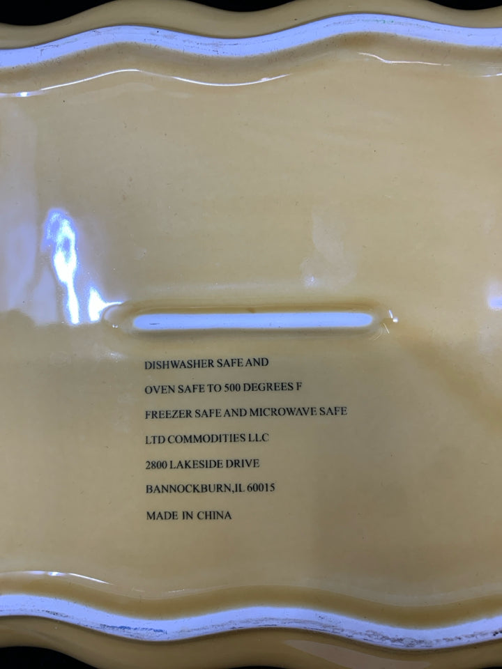 SMALL YELLOW SQUARE BROWN EDGE HANDLES BAKING DISH.