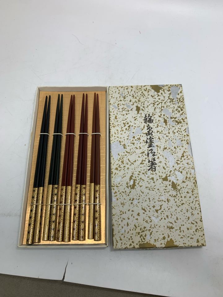 IN BOX 5 SETS OF CHOPSTICKS.
