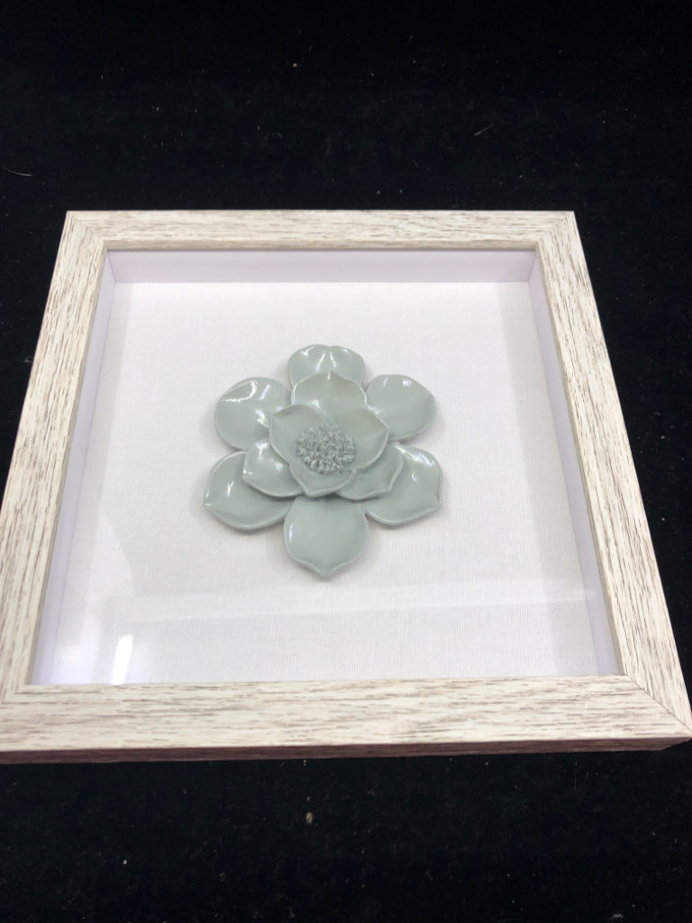 TEAL FLOWER IN SHADOW BOX WALL ART IN GREY FRAME.