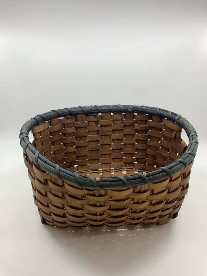 OVAL WOVEN BASKET W/BLUE RIM.