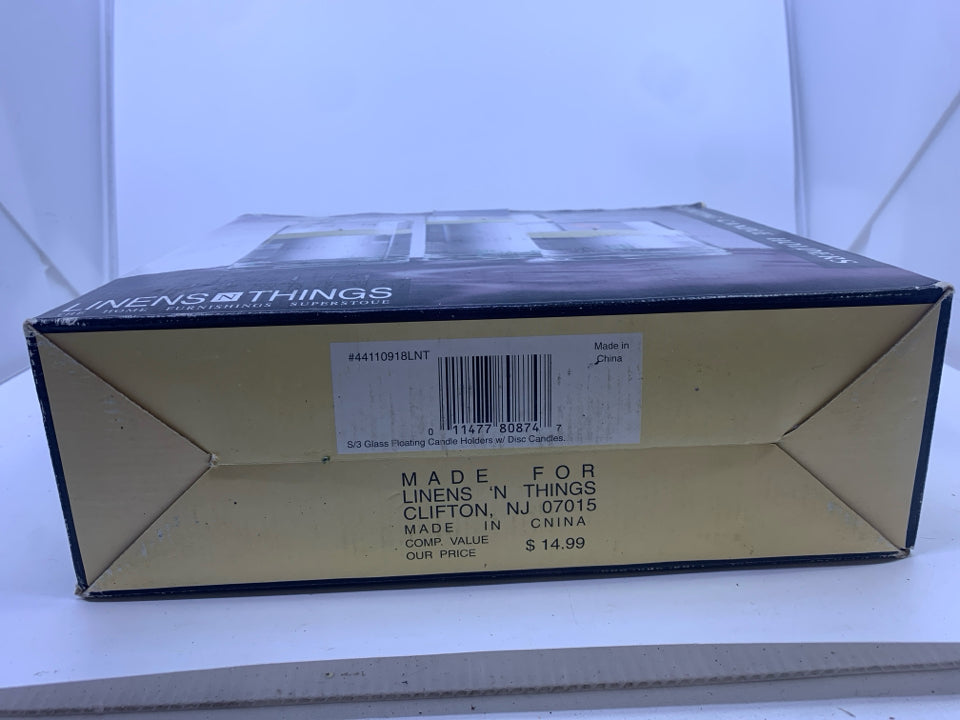 NIB FLOATING CANDLE HOLDERS.
