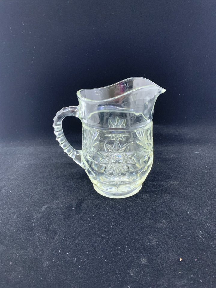 SMALL CUT GLASS STAR PATTERN PITCHER.