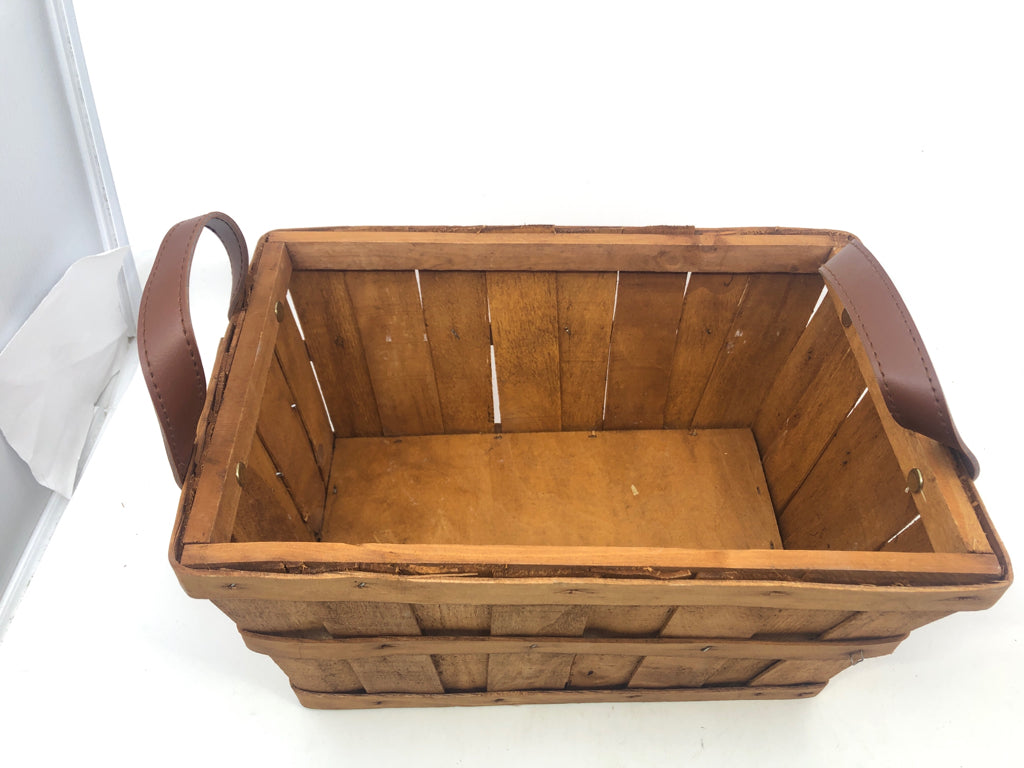 WOOD RECTANGLE BASKET W FAUX LEATHER HANDLES.