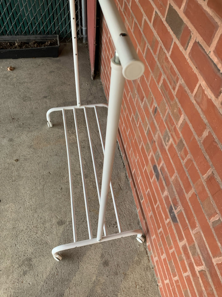 WHITE CLOTHES RACK ON WHEELS & ADJUSTABLE HEIGHT.
