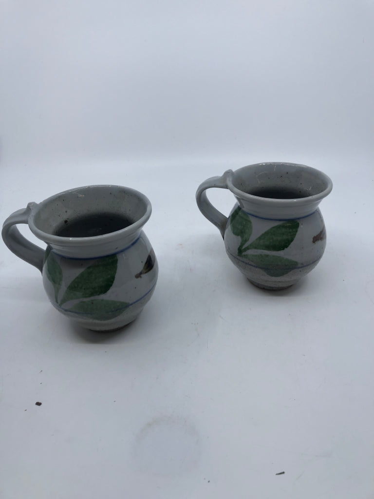 2 GREY POTTERY MUGS W GREEN LEAVES.