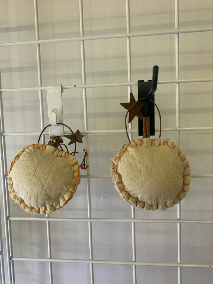 2 PRIMITIVE WALL HANGING PUMPKINS.