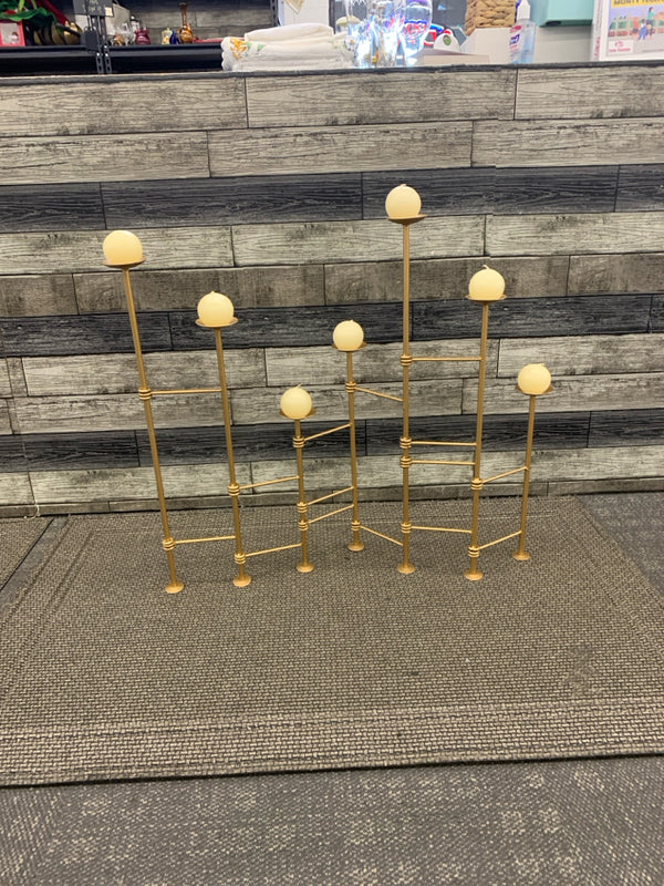 GOLD ADJUSTABLE FIRE PLACE CANDLE HOLDER.