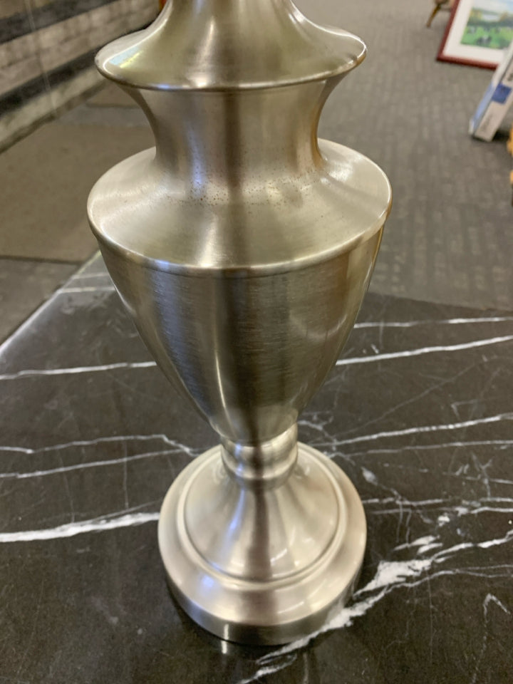 SILVER BASE LAMP W WHITE RUFFLED SHADE.