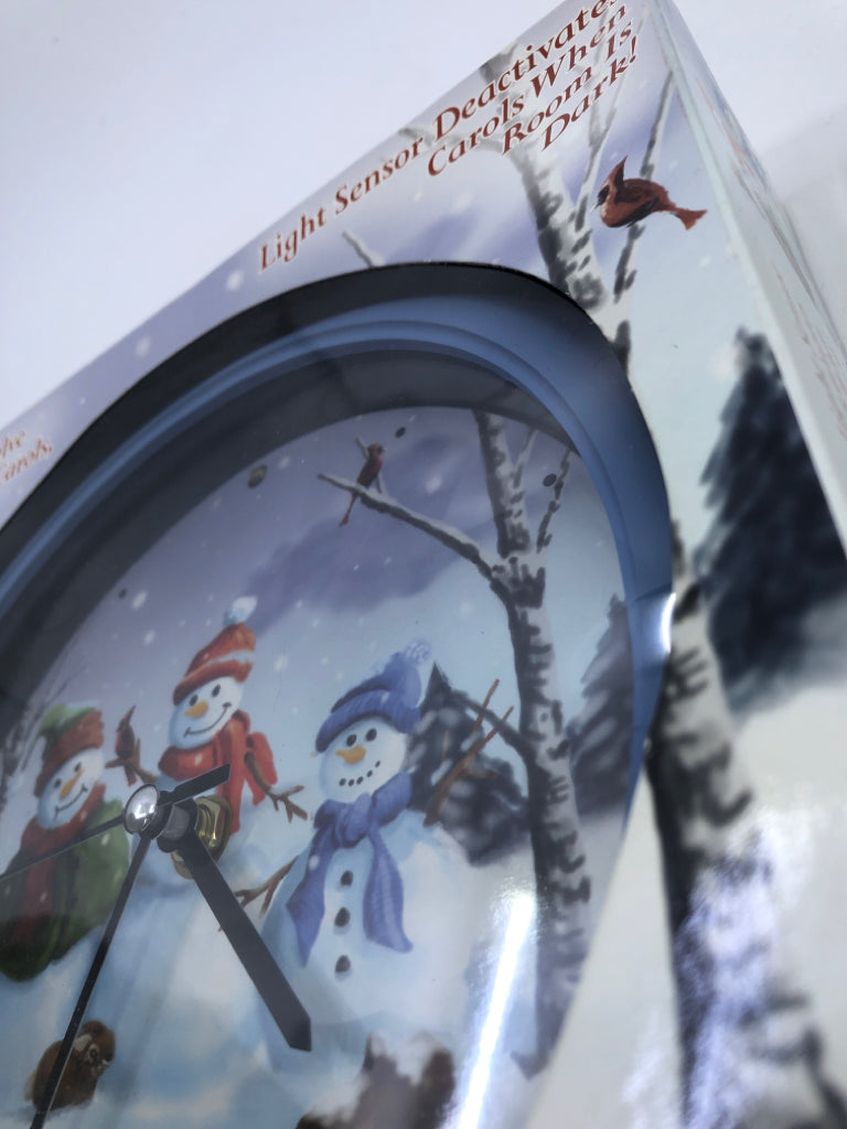 NIB SNOW FAMILY CHRISTMAS CAROL CLOCK.