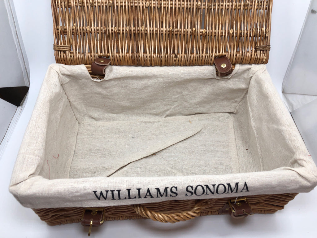 WOVEN BASKET W/FABRIC LINER AND FAUX LEATHER BUCKLES.
