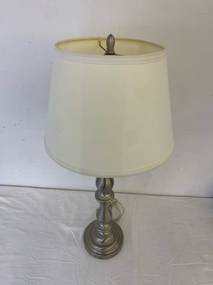 SILVER BASE LAMP W/ WHITE SHADE.