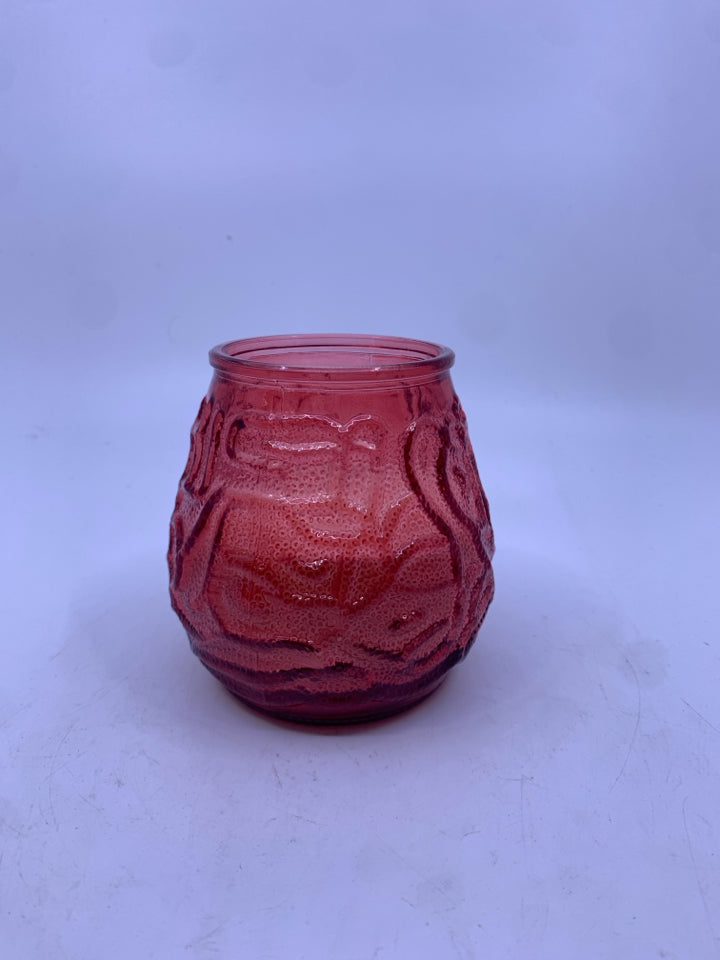 RED GLASS CANDLE W/ EMBOSSED SQUIGGLES.