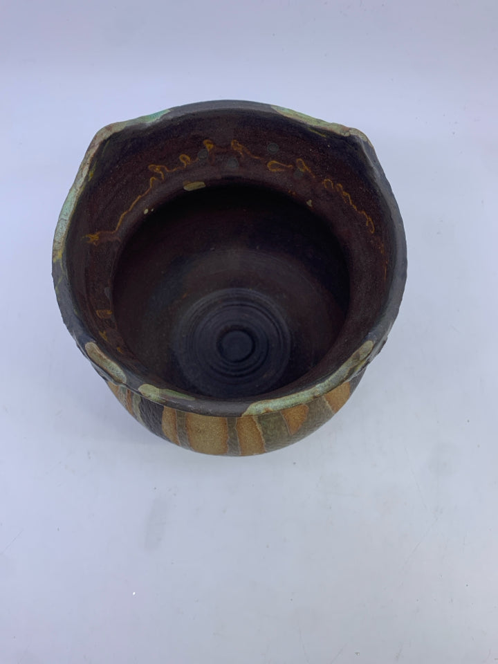 GREEN AND BROWN CARVED POTTERY VASE.