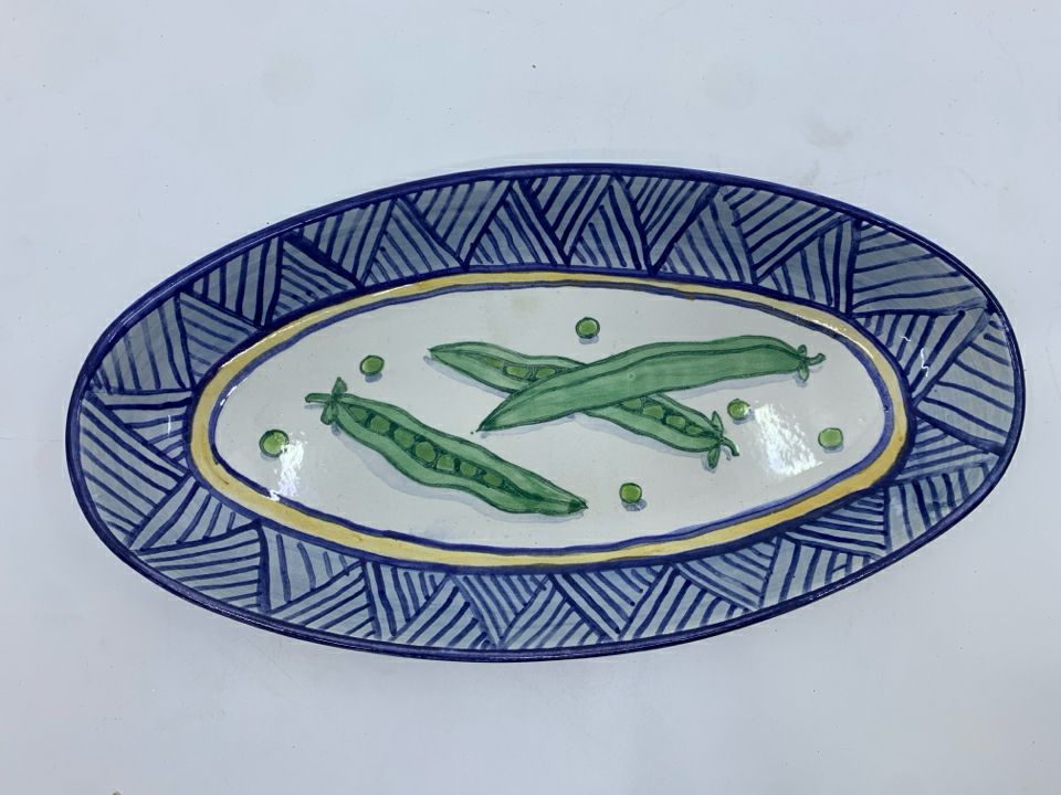 OVAL PAINTED SERVER W PEA PODS ON IT.