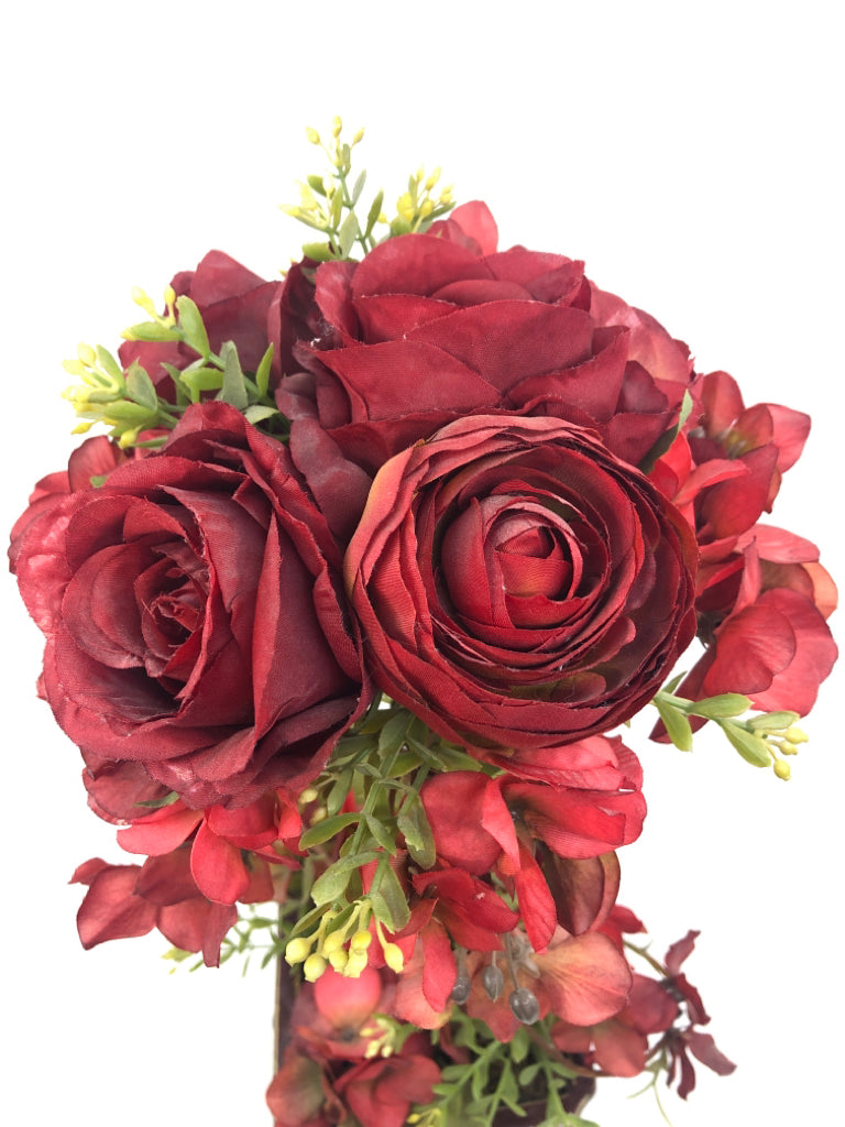 DISTRESSED RED PLANTER W/ FAUX RED FLOWERS.