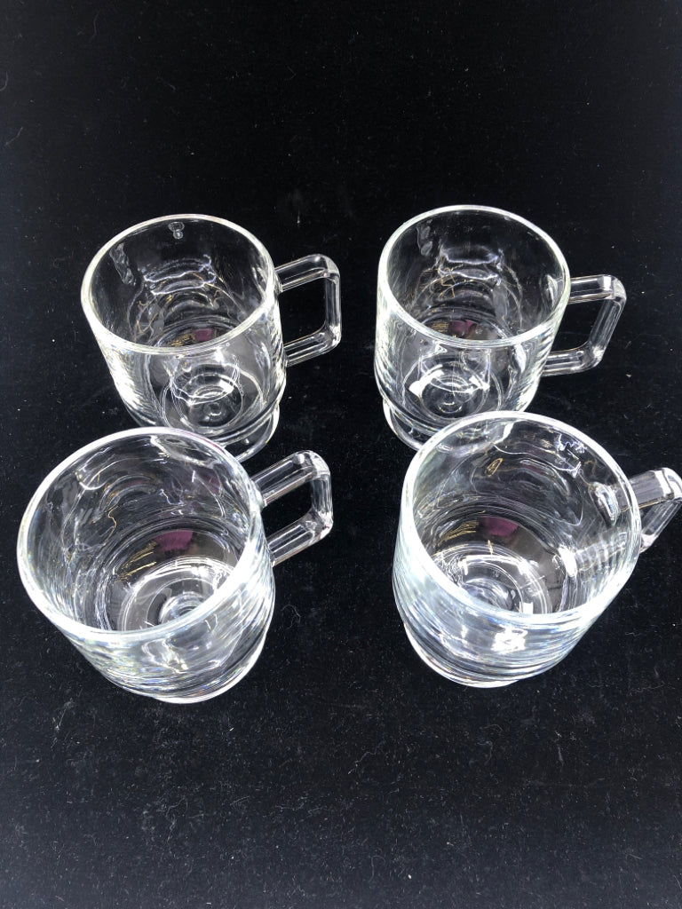 4 FOOTED GLASS MUGS.