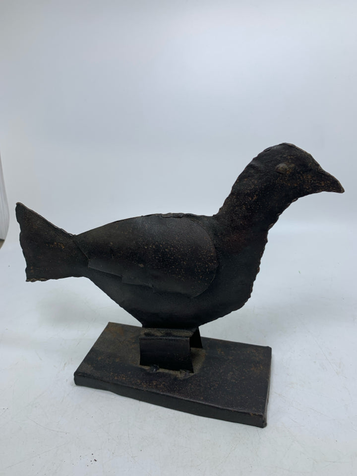 RUSTIC METAL CROW ON STAND.
