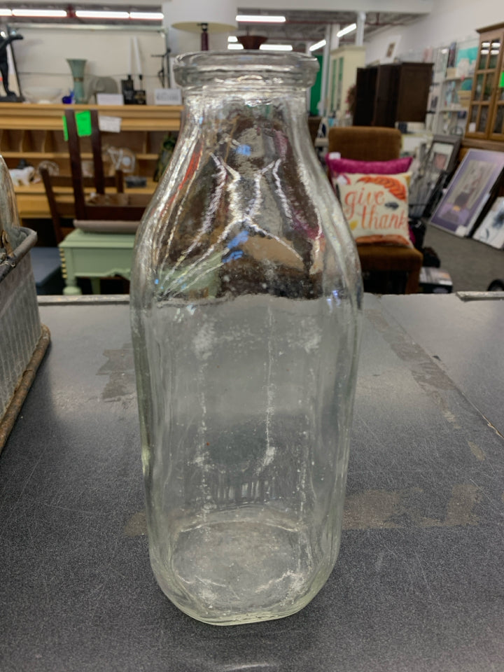 CLEAR MILK EMPTY BOTTLE.