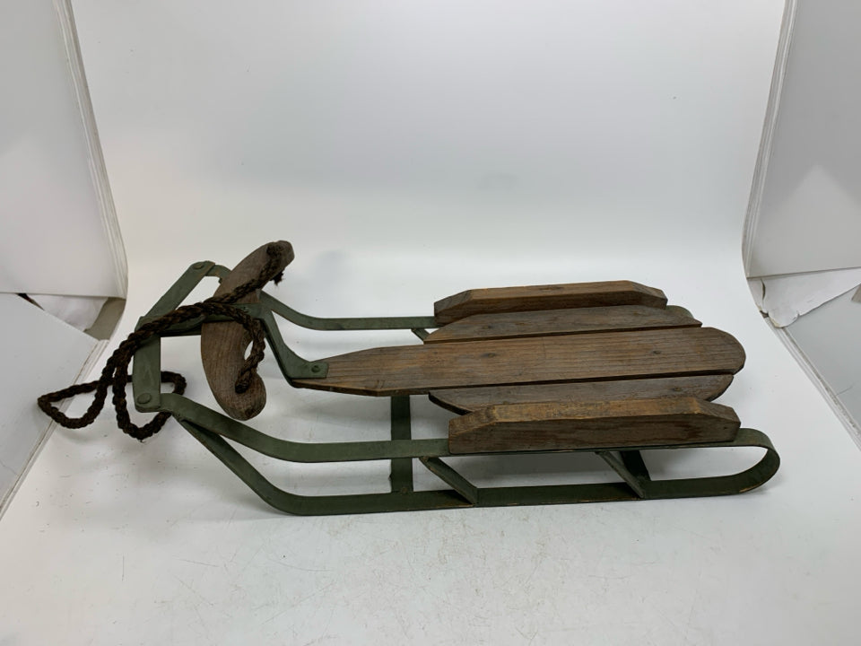 GREEN METAL BASE W/ WOOD SLATES SLED.
