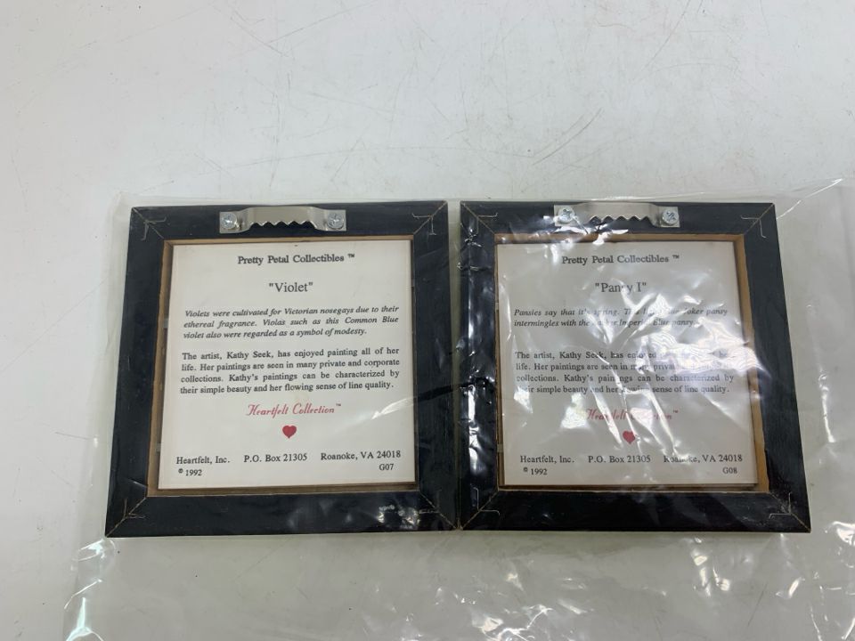 2 MINI VIOLET/PANSY FLOWER PICTURES IN GOLD FRAMES IN BAG.