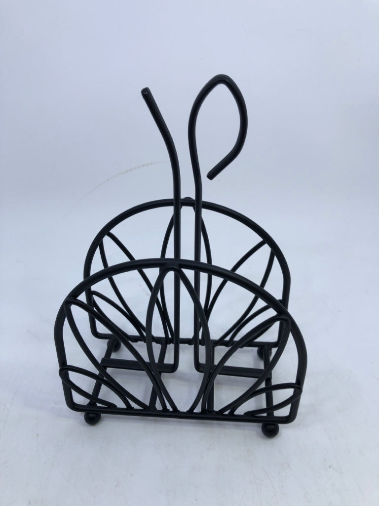 BLACK METAL CUTOUT NAPKIN HOLDER.