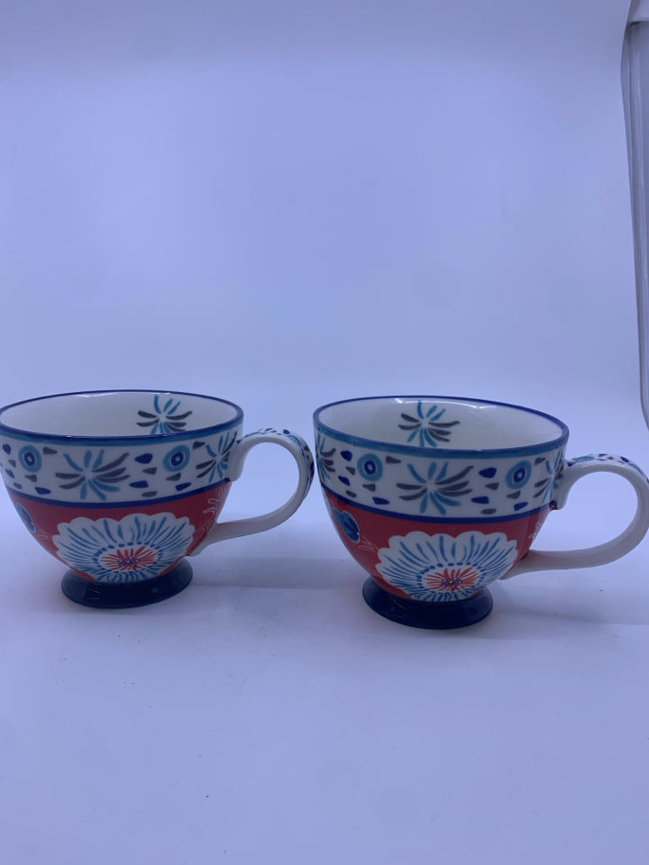 2 POTTERY STUDIO FLORAL MUGS.