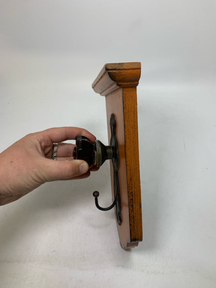 RUSTING DOOR KNOB HOOK WALL HANGING.
