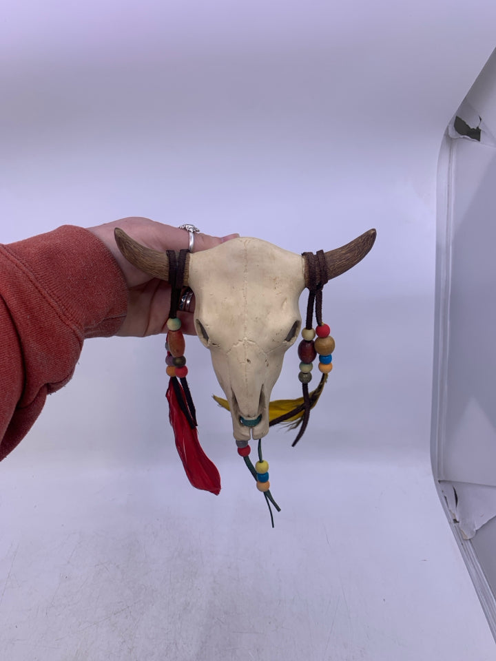 CERAMIC COW SKULL W/ HANGING BEADS/FEATHERS.