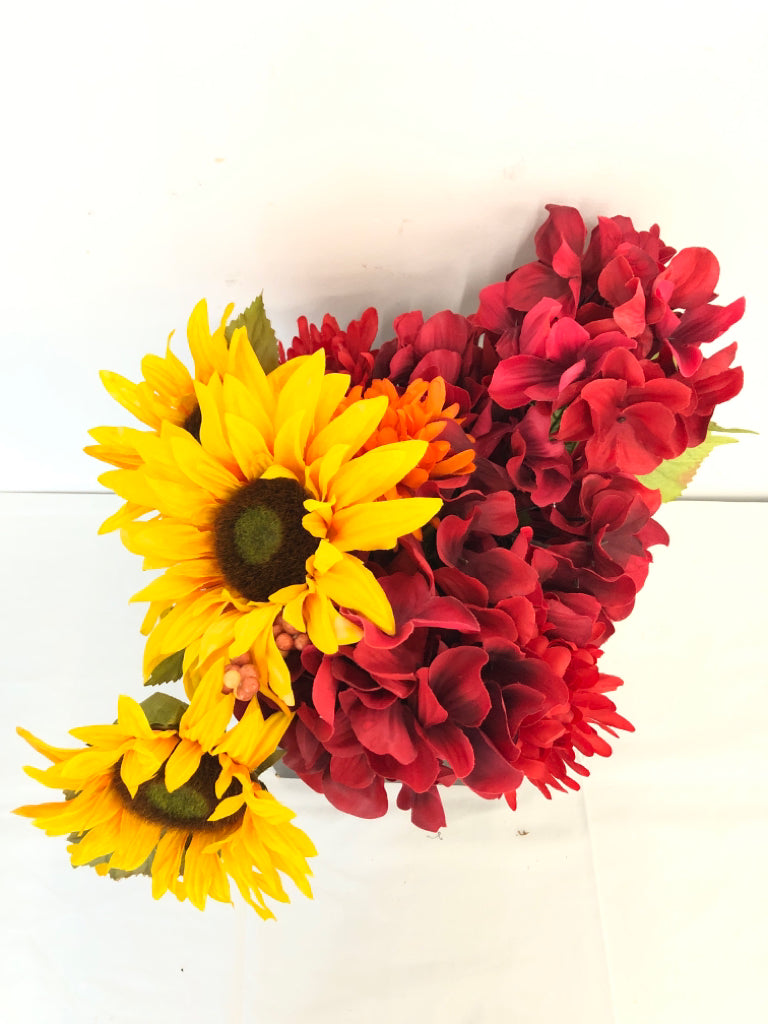 RED AND YELLOW FAUX FLORAL IN BROWN VASE.