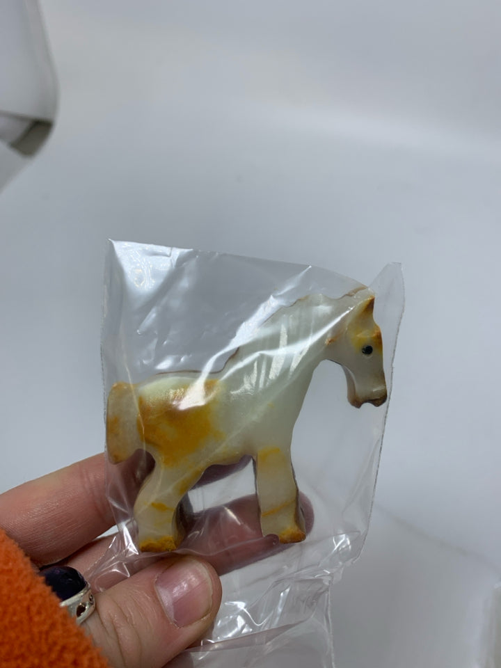 STONE CARVED HORSE IN BAG.