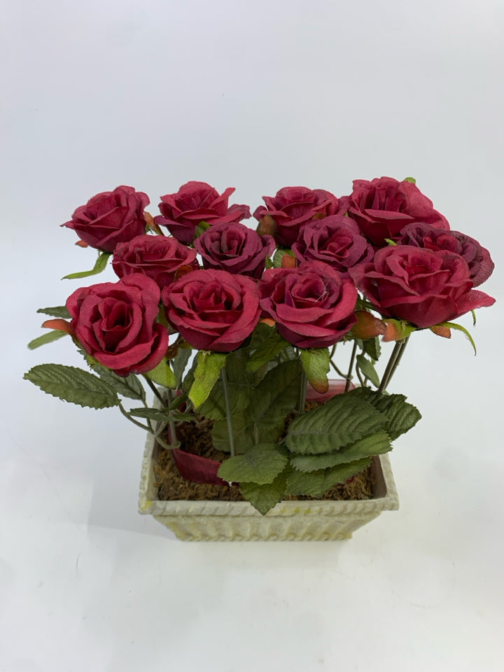 RED ROSE FAUX FLOWERS IN WHITE DECORATED RECTANGULAR POT W/RED RIBBON.