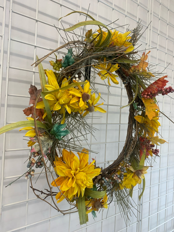 YELLOW FLORAL AND TWIG WREATH.