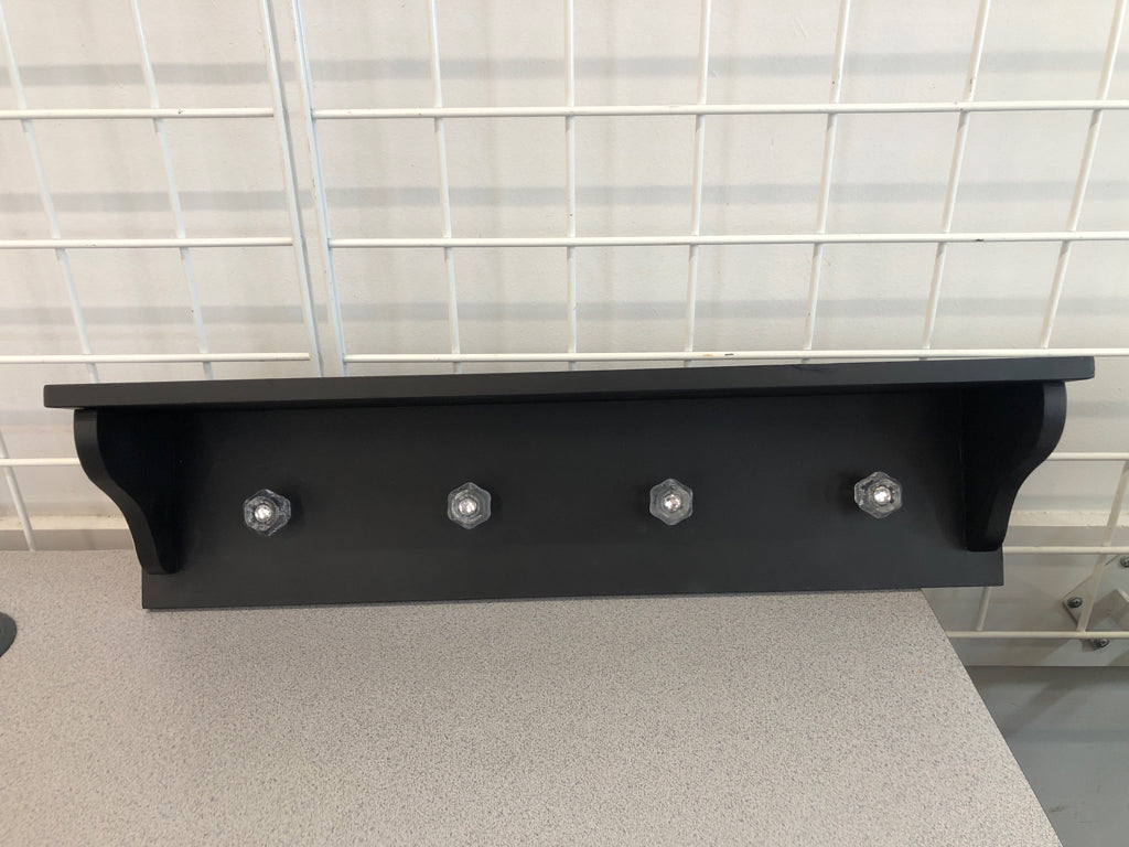 4 HOOK BLACK WALL SHELF W/CLEAR HOOKS.