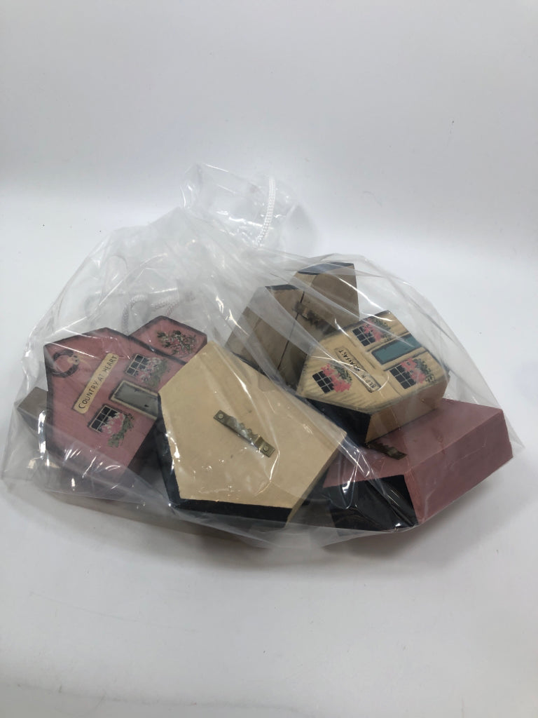 7 WOOD PAINTED BLOCK HOUSES IN BAG.