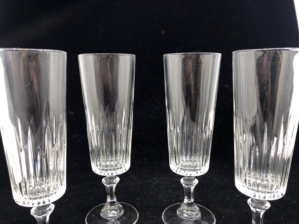 4 FOOTED CHAMPAGNE GLASS CUT GLASS BOTTOM.