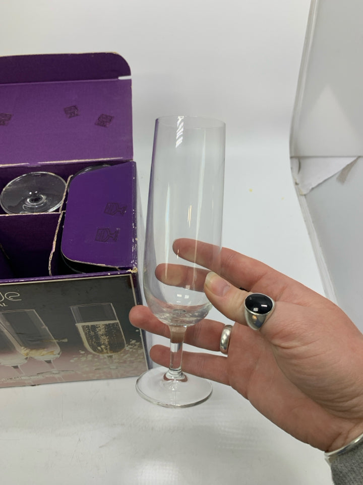 IN BOX 6 EUROPEAN CRYSTAL CHAMPAGNE FLUTES.
