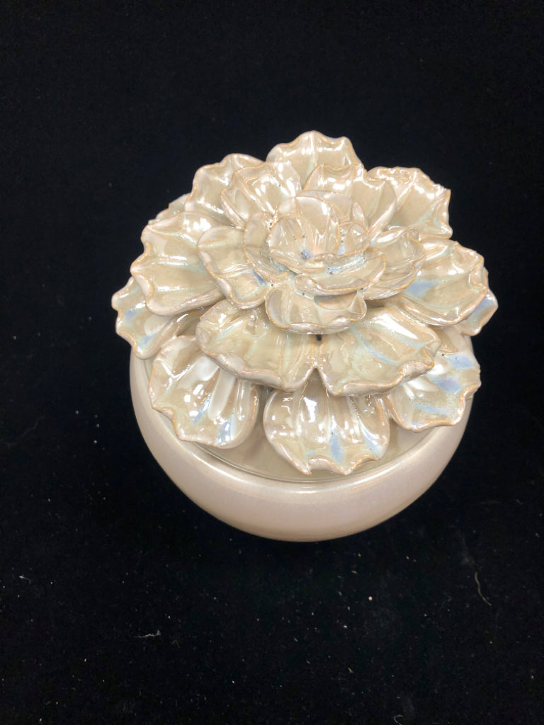 IRIDESCENT CERAMIC JAR W/FLOWER LID.