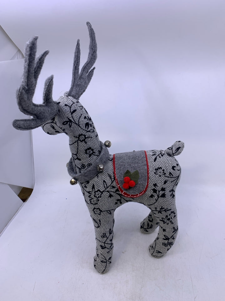 GREY W/ EMBROIDERED BLACK FLOWERS STANDING REINDEER PLUSH.