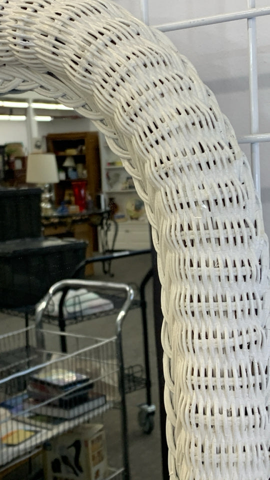 WHITE WICKER OVAL WALL MIRROR.