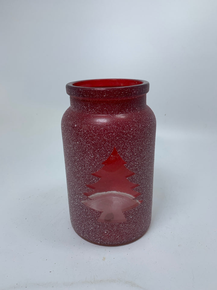 FROSTED RED CANDLE JAR W/ CHRISTMAS TREE OUTLINE.