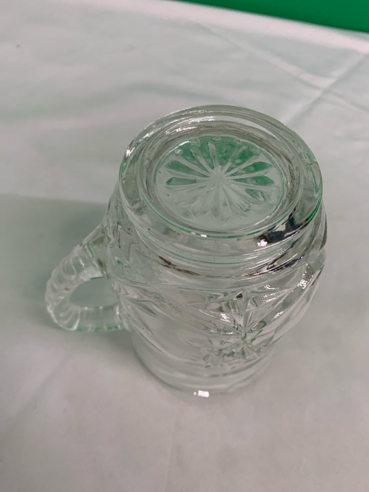 HEAVY CUT GLASS STAR PATTERN PITCHER.