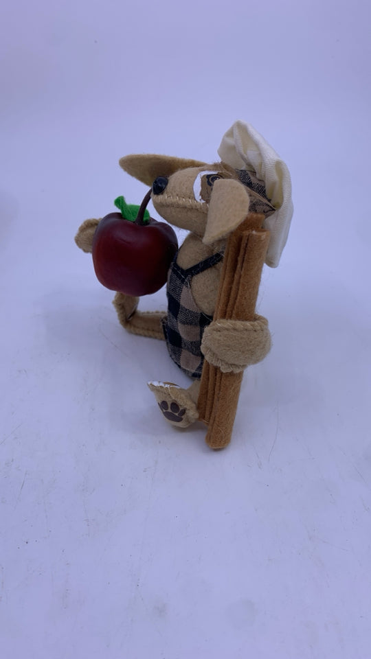 ANNA LEE FELT DOG HOLDING APPLE AND CINNAMON.