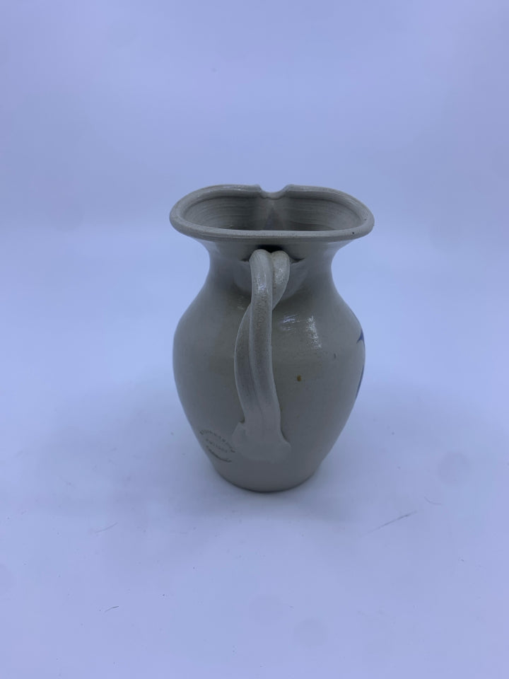 SMALL POTTERY JUG W/BLUE FLOWER.