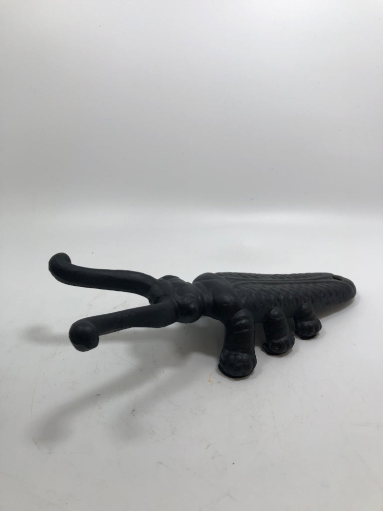 BLACK METAL BEETLE BOOT JACK.