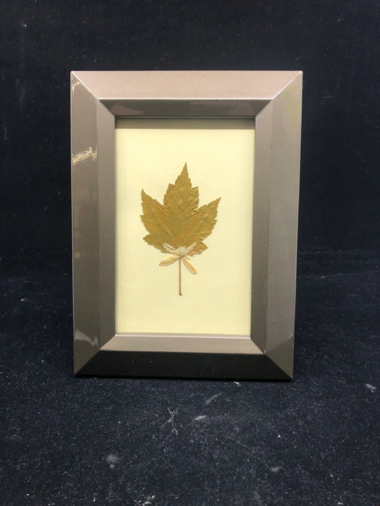 GOLD LEAF IN BRONZE COLORED FRAME.