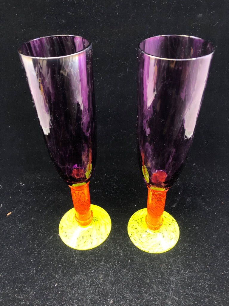 2 MULTI COLORED BLOWN GLASS CHAMPAGNE FLUTES.