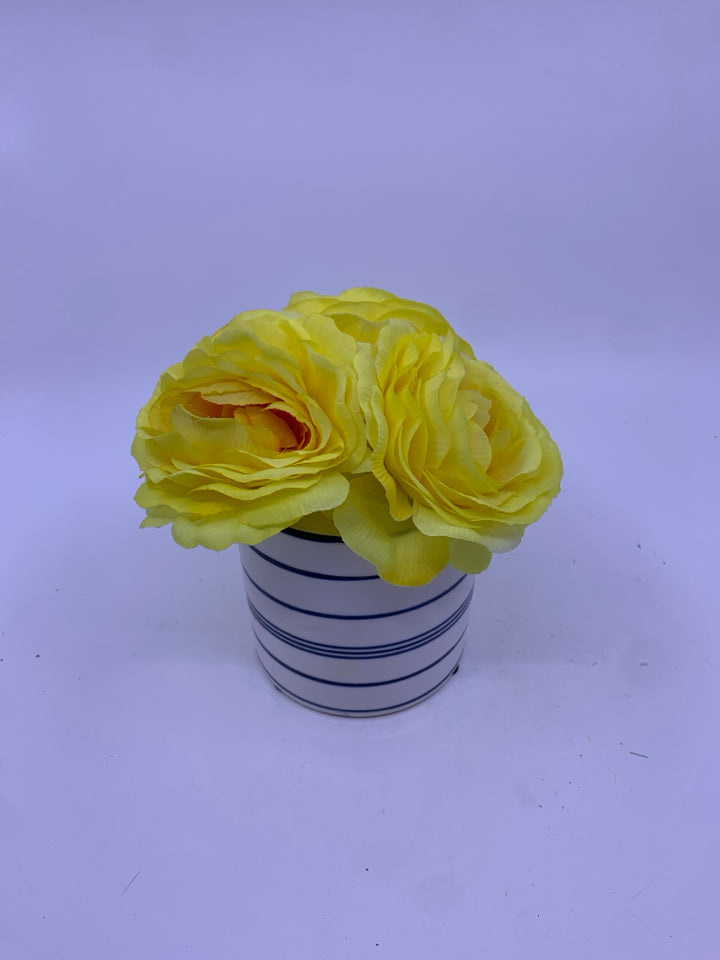 YELLOW FLORAL IN BLUE AND WHITE VASE.