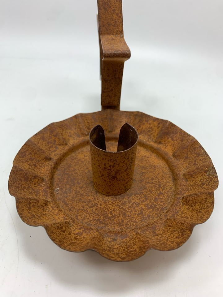 PRIMITIVE BROWN METAL STAR CANDLESTICK HOLDER.