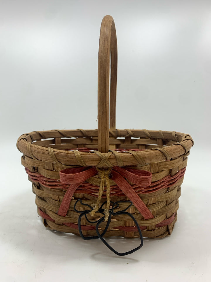 OVAL BASKET W/PINK STRIPES AND METAL APPLES.